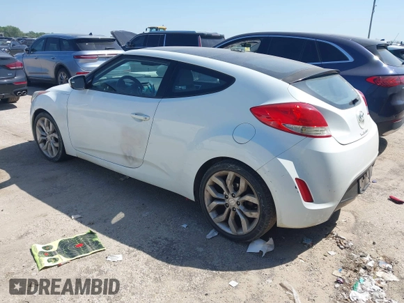 2013 Hyundai Veloster w/Black Int z VIN KMHTC6AD6DU107198, wystawiony jako IAAI lot #41983969 z przebiegiem 164 819 mil mil oraz . Historia ofert i sprzedaży dostępna na DreamBid. Obrazek 3.