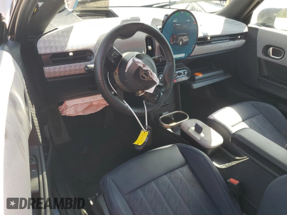 2025 MINI Hardtop Cooper S with VIN WMW23GD00S2W74060, listed as a Copart auction lot 52106175 with 410 mi miles and Salvage Title. Bid and sale history available at DreamBid. Image 8.