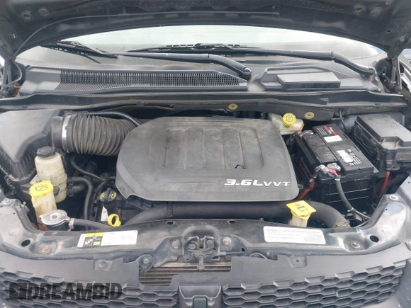 2015 Dodge Grand Caravan American Value with VIN 2C4RDGBGXFR682995, listed as a IAAI auction lot 41994708 with 142,725 mi miles and . Bid and sale history available at DreamBid. Image 10.