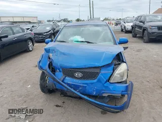 2009 Kia Rio LX with VIN KNADE243296494243, listed as a IAAI auction lot 41307888 with 133,487 mi miles. Bid and sale history available at carsss.com. Image 12.