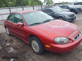 1999 Mercury Sable GS with VIN 1MEFM50UXXA649466, listed as a IAAI auction lot 42094811 with 122,644 mi miles. Bid and sale history available at carsss.com. Image 1.