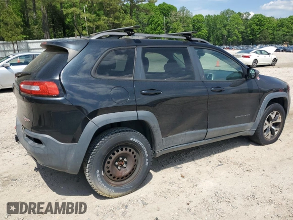 2014 Jeep Cherokee Trailhawk with VIN 1C4PJMBS1EW242527, listed as a Copart auction lot 53160485 with 104,074 mi miles and Salvage Title. Bid and sale history available at carsss.com. Image 3.