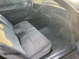 1987 Buick Regal with VIN 1G4GJ11Y4HP413978, listed as a Copart auction lot 87311954 with 52,519 mi miles and Salvage Title. Bid and sale history available at DreamBid. Image 5.