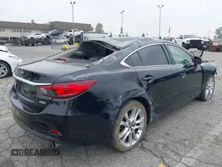 2014 Mazda 6 i Touring with VIN JM1GJ1T6XE1162480, listed as a IAAI auction lot 42150777 with 148,113 mi miles and . Bid and sale history available at DreamBid. Image 4.