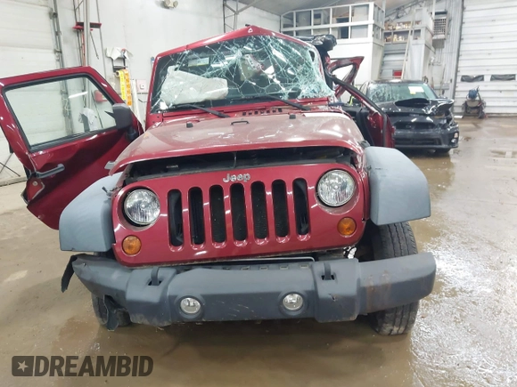 2011 Jeep Wrangler Sport z VIN 1J4AA2D19BL613164, wystawiony jako IAAI lot #42514207 z przebiegiem Nie podano mil oraz . Historia ofert i sprzedaży dostępna na DreamBid. Obrazek 11.