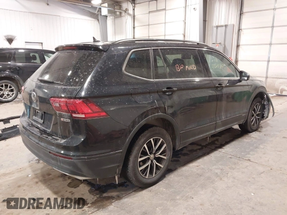 2019 Volkswagen Tiguan SE with VIN 3VV2B7AX3KM017948, listed as a IAAI auction lot 41564360 with 129,302 mi miles and . Bid and sale history available at DreamBid. Image 4.