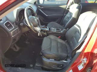 2016 Mazda CX-5 Grand Touring z VIN JM3KE4DY9G0753691, wystawiony jako Copart lot #57361645 z przebiegiem 90 733 mil mil oraz Szkoda całkowita • Salvage title. Historia ofert i sprzedaży dostępna na DreamBid. Obrazek 7.