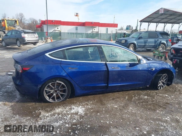 2018 Tesla Model 3 Long Range Battery with VIN 5YJ3E1EB8JF115138, listed as a IAAI auction lot 41343399 with 62,351 mi miles and . Bid and sale history available at DreamBid. Image 14.
