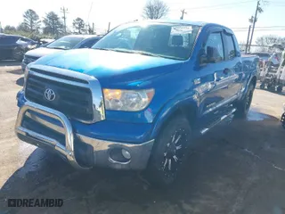 2010 Toyota Tundra 4WD Truck with VIN 5TFUW5F11AX143609, listed as a IAAI auction lot 41498326 with 140,716 mi miles. Bid and sale history available at carsss.com. Image 2.