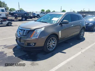 2015 Cadillac SRX Performance Collection with VIN 3GYFNFE35FS569682, listed as a IAAI auction lot 42322229 with 124,365 mi miles and . Bid and sale history available at DreamBid. Image 2.