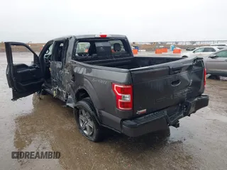 2019 Ford F-150 XL with VIN 1FTEW1C56KKC31025, listed as a IAAI auction lot 41452618 with 153,422 mi miles and . Bid and sale history available at DreamBid. Image 3.