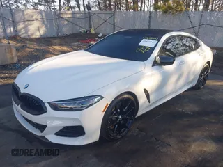 2023 BMW 8 Series M850i with VIN WBAGV8C0XPCL58173, listed as a IAAI auction lot 41693747 with 24,954 mi miles. Bid and sale history available at carsss.com. Image 2.