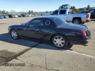2004 Ford Thunderbird Deluxe with VIN 1FAHP60A94Y105675, listed as a Copart auction lot 87677015 with 91,154 mi miles and Salvage Title. Bid and sale history available at DreamBid. Image 2.