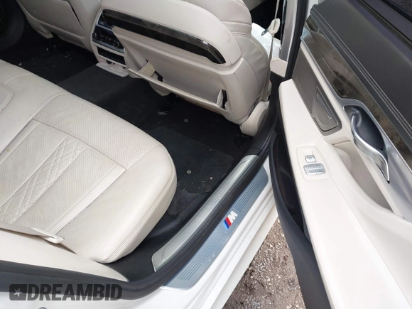 2016 BMW 7 Series 740i with VIN WBA7E2C50GG714647, listed as a IAAI auction lot 41745442 with 134,399 mi miles and . Bid and sale history available at carsss.com. Image 8.