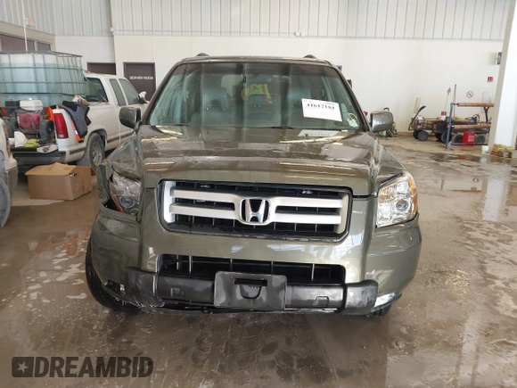 2006 Honda Pilot EX-L with VIN 5FNYF187X6B026463, listed as a IAAI auction lot 41612181 with 242,828 mi miles and . Bid and sale history available at DreamBid. Image 12.