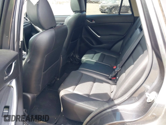2016 Mazda CX-5 Grand Touring z VIN JM3KE4DY1G0893119, wystawiony jako IAAI lot #42049614 z przebiegiem 102 506 mil mil oraz . Historia ofert i sprzedaży dostępna na DreamBid. Obrazek 8.