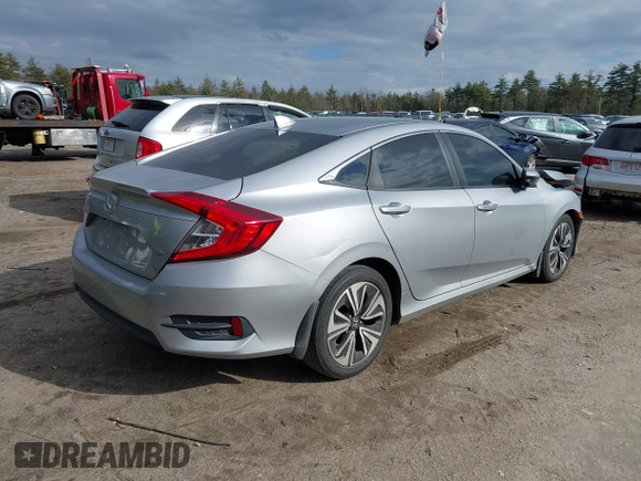 2018 Honda Civic EX-T z VIN 2HGFC1F34JH641837, wystawiony jako IAAI lot #41858089 z przebiegiem 65 318 mil mil oraz . Historia ofert i sprzedaży dostępna na DreamBid. Obrazek 4.