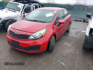 2014 Kia Rio LX with VIN KNADM4A36E6417050, listed as a IAAI auction lot 42005888 with 129,433 mi miles. Bid and sale history available at carsss.com. Image 2.