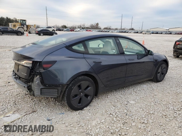 2022 Tesla Model 3 Long Range with VIN 5YJ3E1EB0NF269249, listed as a Copart auction lot 87318524 with 18,406 mi miles and Salvage Title. Bid and sale history available at DreamBid. Image 3.