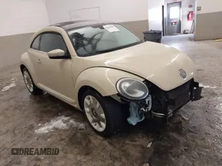 2019 Volkswagen Beetle S with VIN 3VWFD7ATXKM705322, listed as a IAAI auction lot 41409600 with 97,479 mi miles. Bid and sale history available at carsss.com. Image 1.
