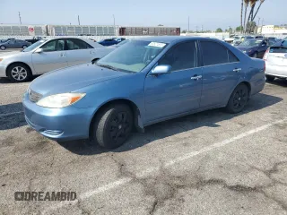 2002 Toyota Camry LE z VIN 4T1BE32K72U618563, wystawiony jako Copart lot #60527555 z przebiegiem 221 371 mil mil oraz Czysty tytuł • Clean title. Historia ofert i sprzedaży dostępna na DreamBid. Obrazek 1.