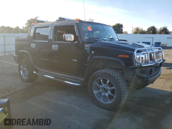 2005 Hummer H2 SUT z VIN 5GRGN22U15H101289, wystawiony jako Copart lot #84107974 z przebiegiem Nie podano mil oraz Szkody całkowita. Historia ofert i sprzedaży dostępna na DreamBid. Obrazek 4.
