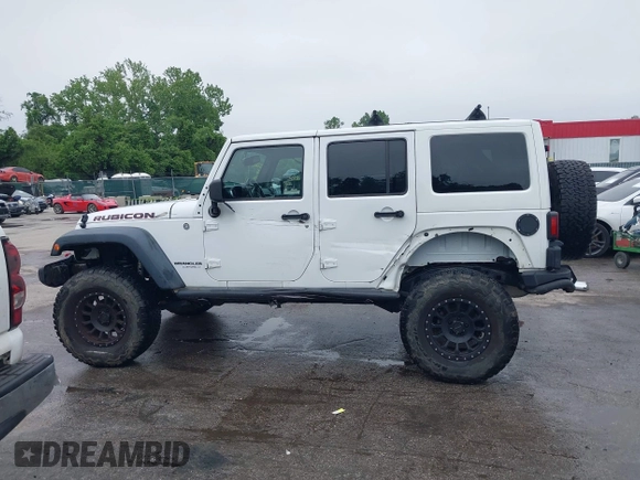 2014 Jeep Wrangler Unlimited Rubicon with VIN 1C4HJWFG4EL104827, listed as a IAAI auction lot 42236622 with 90,935 mi miles and . Bid and sale history available at DreamBid. Image 15.