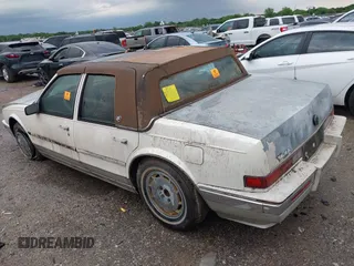 1990 Cadillac Seville z VIN 1G6KY533XLU803161, wystawiony jako IAAI lot #42164352 z przebiegiem Nie podano mil oraz . Historia ofert i sprzedaży dostępna na DreamBid. Obrazek 3.