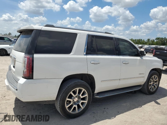2015 GMC Yukon Denali with VIN 1GKS1CKJ3FR579085, listed as a Copart auction lot 67657084 with 98,456 mi miles and Salvage Title. Bid and sale history available at carsss.com. Image 3.