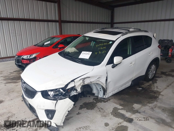 2014 Mazda CX-5 Touring with VIN JM3KE4CY9E0370610, listed as a IAAI auction lot 42016896 with 72,340 mi miles. Bid and sale history available at carsss.com. Image 16.