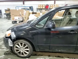 2011 Suzuki SX4 LE z VIN JS2YC5A28B6300625, wystawiony jako Copart lot #54044155 z przebiegiem 179 269 mil mil oraz Szkoda całkowita • Salvage title. Historia ofert i sprzedaży dostępna na DreamBid. Obrazek 13.