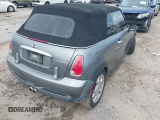 2006 MINI Convertible S with VIN WMWRH33586TF87791, listed as a IAAI auction lot 42679478 with 90,209 mi miles and . Bid and sale history available at DreamBid. Image 4.