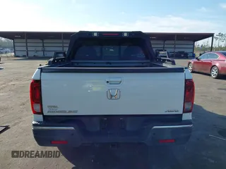 2018 Honda Ridgeline RTL-E with VIN 5FPYK3F71JB001753, listed as a IAAI auction lot 41510248 with 84,551 mi miles and . Bid and sale history available at DreamBid. Image 16.