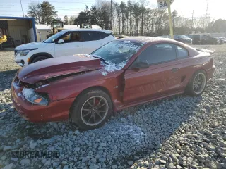 1996 Ford Mustang GT z VIN 1FALP42X0TF168223, wystawiony jako Copart lot #46351085 z przebiegiem 121 657 mil mil oraz Szkoda całkowita • Salvage title. Historia ofert i sprzedaży dostępna na DreamBid. Obrazek 1.