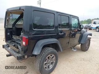 2015 Jeep Wrangler Unlimited Rubicon with VIN 1C4BJWFG7FL688728, listed as a IAAI auction lot 42054304 with 100,152 mi miles and . Bid and sale history available at DreamBid. Image 4.