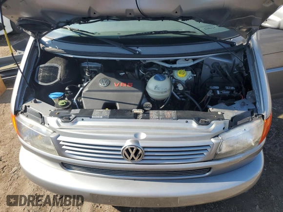 2000 Volkswagen EuroVan с VIN WV2MH4703YH013265, выставлен на аукционе Copart как лот 59003645 с пробегом Не указан миль и Списание • Salvage title. История ставок и продаж доступна на DreamBid. Изображение 12.