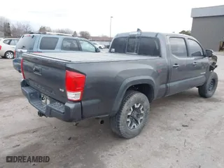 2016 Toyota Tacoma SR5 with VIN 3TMDZ5BN3GM010607, listed as a IAAI auction lot 41757738 with 154,686 mi miles. Bid and sale history available at carsss.com. Image 4.