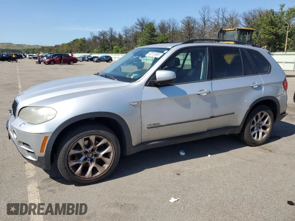 2012 BMW X5 35i with VIN 5UXZV4C5XCL749204, listed as a Copart auction lot 62012985 with 94,636 mi miles and Clean title. Bid and sale history available at DreamBid. Image 1.