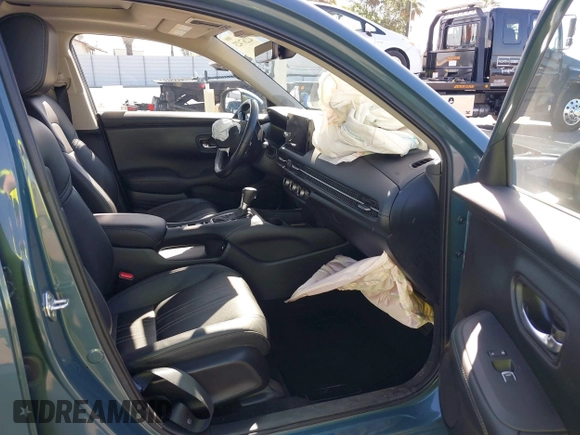2023 Honda HR-V EX-L with VIN 3CZRZ1H77PM702998, listed as a IAAI auction lot 42267423 with 25,438 mi miles and . Bid and sale history available at DreamBid. Image 5.