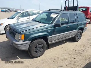1994 Jeep Grand Cherokee Laredo with VIN 1J4GZ58S0RC266616, listed as a IAAI auction lot 41890812 with 190,000 mi miles. Bid and sale history available at carsss.com. Image 2.