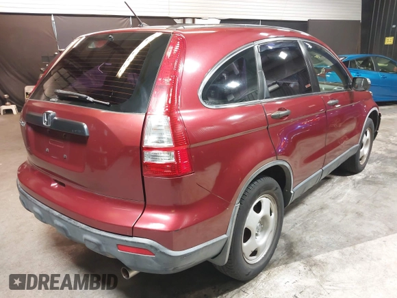 2009 Honda CR-V LX with VIN JHLRE48339C018957, listed as a IAAI auction lot 41952951 with 76,502 mi miles. Bid and sale history available at carsss.com. Image 4.
