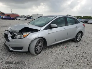 2018 Ford Focus SE with VIN 1FADP3F28JL256318, listed as a Copart auction lot 55524544 with 136,723 mi miles and Salvage title. Bid and sale history available at DreamBid. Image 1.