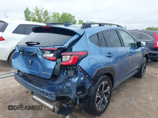 2024 Subaru Crosstrek Premium z VIN JF2GUADC6RH338290, wystawiony jako IAAI lot #42341194 z przebiegiem 10 379 mil mil oraz . Historia ofert i sprzedaży dostępna na DreamBid. Obrazek 4.