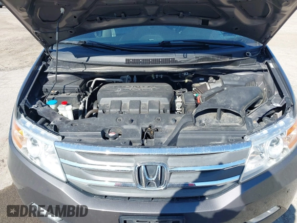 2012 Honda Odyssey Touring with VIN 5FNRL5H9XCB077351, listed as a IAAI auction lot 42045976 with 146,290 mi miles and . Bid and sale history available at DreamBid. Image 10.