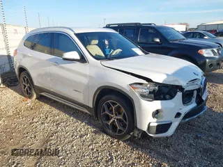 2018 BMW X1 sDrive28i with VIN WBXHU7C36J5H41267, listed as a IAAI auction lot 41270207 with 84,726 mi miles. Bid and sale history available at carsss.com. Image 1.