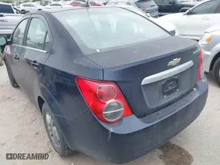 2015 Chevrolet Sonic LT with VIN 1G1JC5SH9F4127898, listed as a IAAI auction lot 41976381 with 148,658 mi miles. Bid and sale history available at carsss.com. Image 3.
