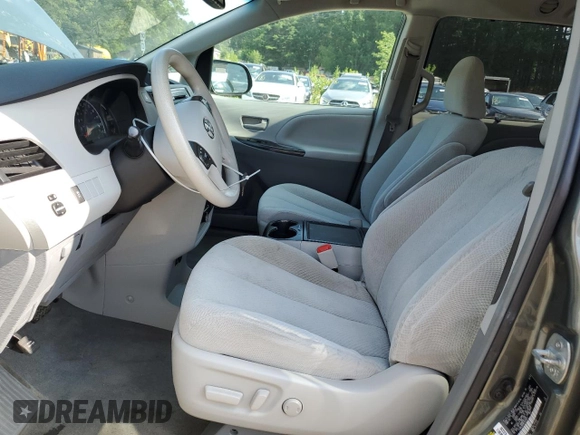 2014 Toyota Sienna LE AAS with VIN 5TDKK3DC9ES424841, listed as a Copart auction lot 59098365 with 168,427 mi miles and Clean title. Bid and sale history available at DreamBid. Image 7.