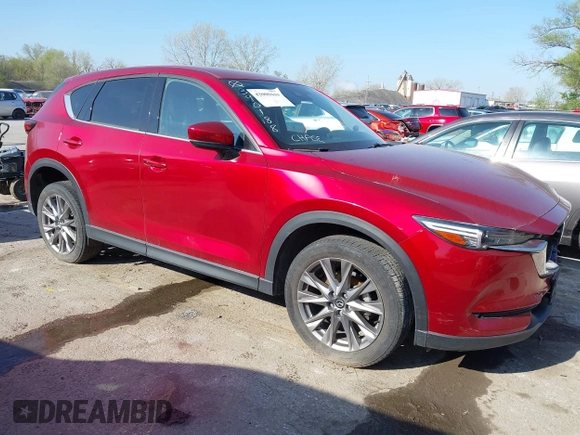 2021 Mazda CX-5 Grand Touring with VIN JM3KFBDM8M1390188, listed as a IAAI auction lot 42000444 with 84,908 mi miles. Bid and sale history available at carsss.com. Image 1.