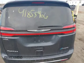 2021 Chrysler Pacifica Hybrid Touring L z VIN 2C4RC1L7XMR593987, wystawiony jako IAAI lot #41855966 z przebiegiem 72 685 mil mil oraz . Historia ofert i sprzedaży dostępna na DreamBid. Obrazek 16.