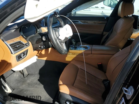2018 BMW 7 Series 750i with VIN WBA7F0C57JGM23040, listed as a Copart auction lot 87392704 with 0 mi miles and Salvage Title. Bid and sale history available at carsss.com. Image 7.
